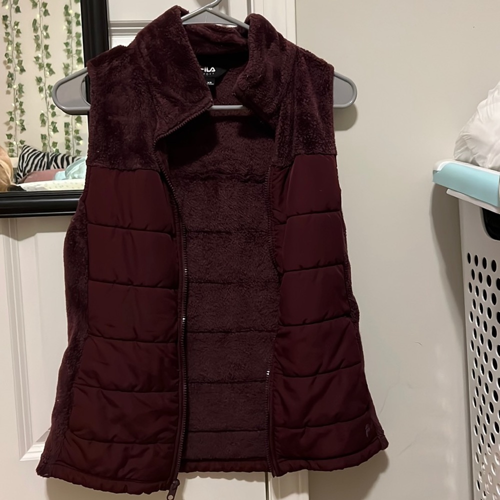 Purple vest with soft neckline and pockets.